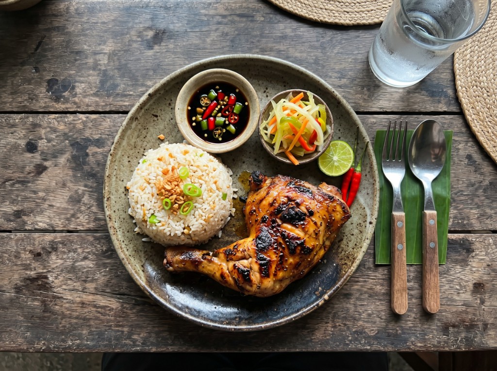 Filipino chicken inasal with garlic rice, atchara, and sawsawan